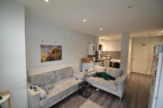 Spacious and inviting living room with comforta...