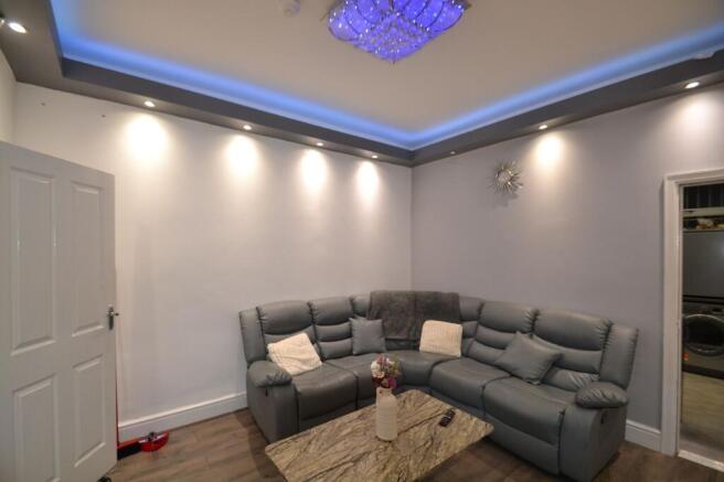 Modern living room with a comfortable grey corn...