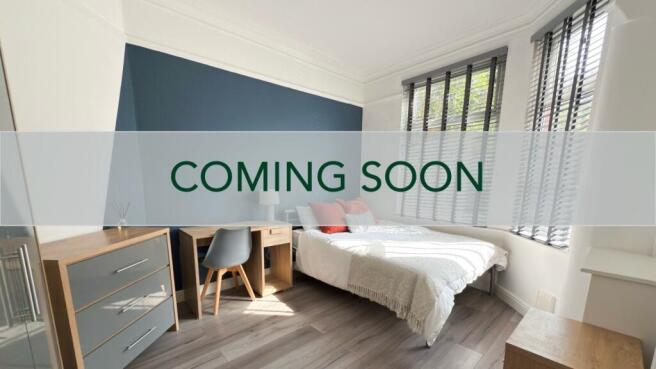 Bright, modern double bedroom with a comfortabl...