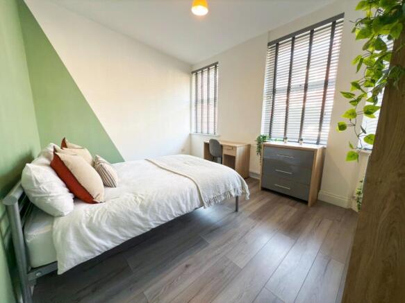 Bright, modern bedroom with a comfortable doubl...