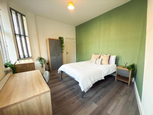 Bright, modern bedroom with a comfortable doubl...