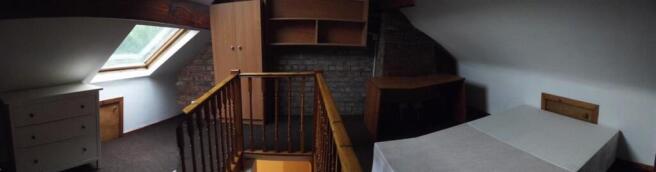 Bright attic bedroom with skylight, fitted stor...