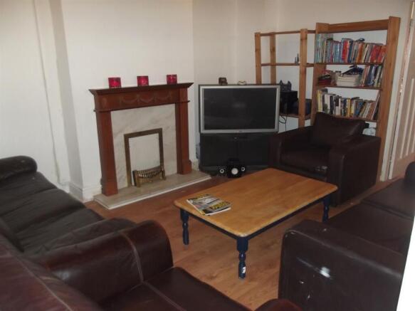 Cozy living room with leather sofas arranged ar...