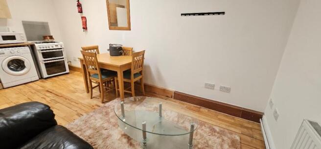 A bright and inviting living room featuring a c...