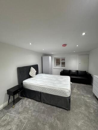A modern double bedroom featuring a comfortable...