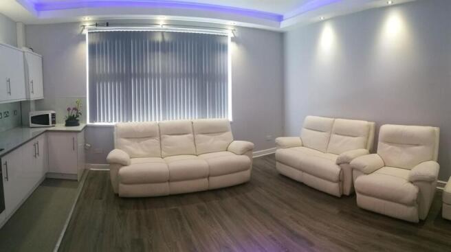 Bright, modern open-plan living area with match...