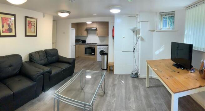 Bright, modern open-plan living area with comfo...