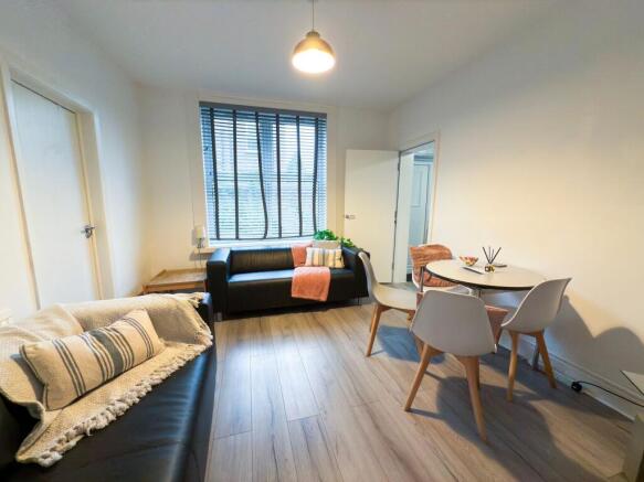 Bright, modern living room with two comfortable...