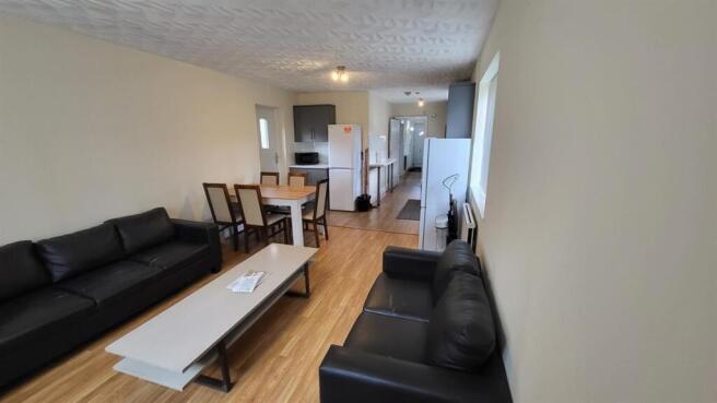 Bright, modern living room with comfortable bla...