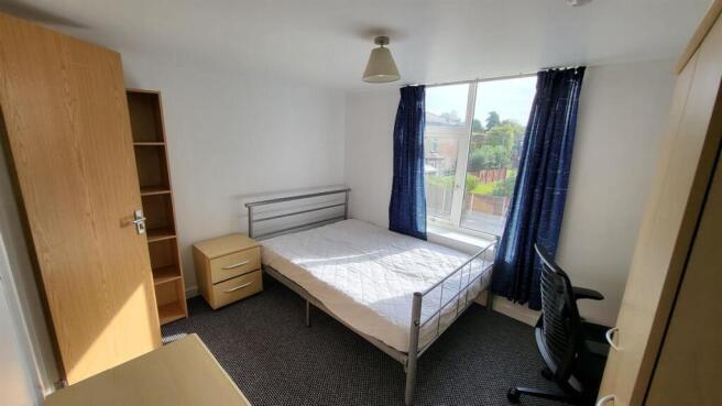 Bright, tidy bedroom with a double bed, fitted ...