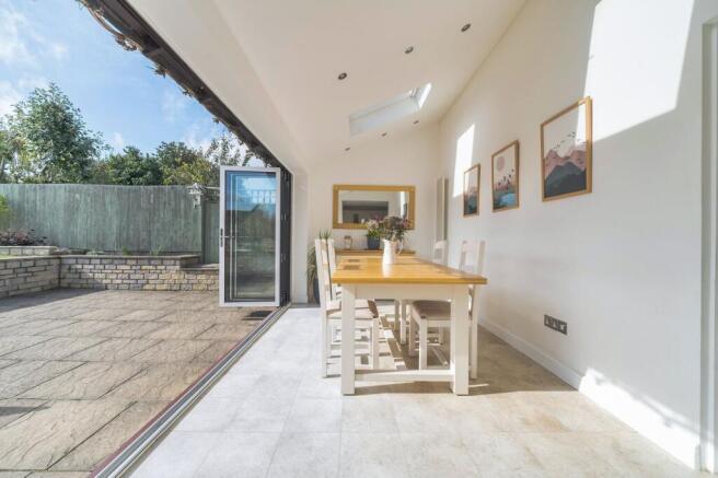 Bright dining area with folding doors onto the dining terrace