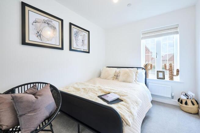 Guests will feel right at home in the second/spare bedroom