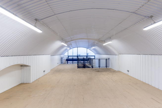 The mezzanine level of an arch with white lining.