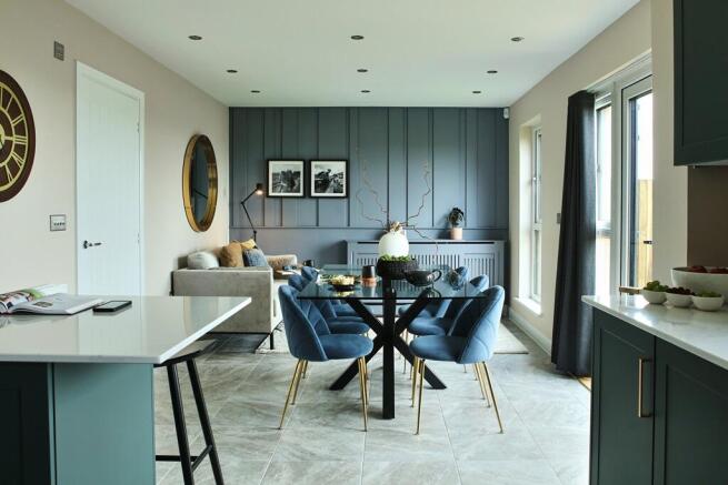 French doors open from the dining area to the rear garden