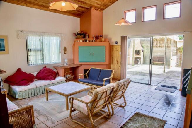 Built in braai with door leading to patio