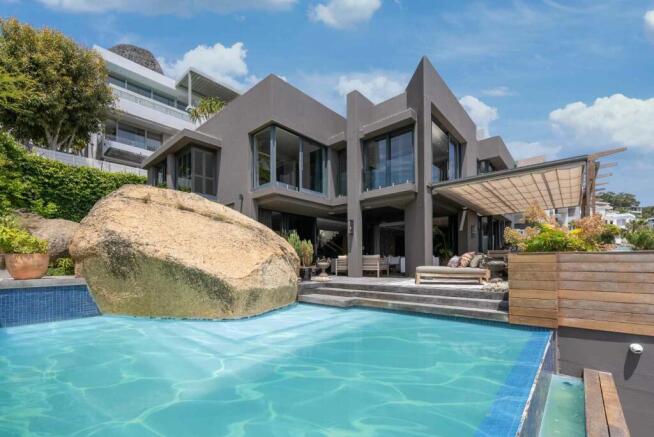 North facing swimming pool, enjoying natural rock feature.