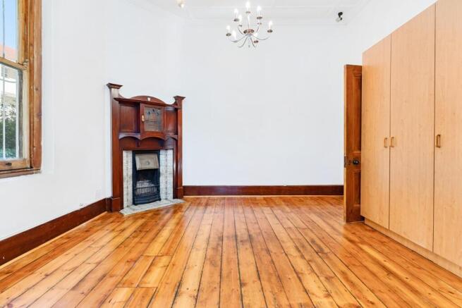 second bedroom with a victorian fireplace