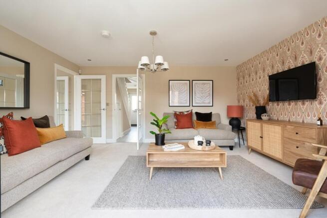 Open plan lounge with French doors opening to the garden