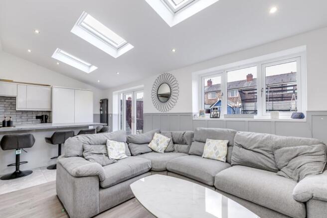 Open plan kitchen diner with seating area