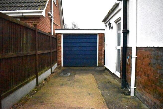 SIDE OF HOUSE TO GARAGE