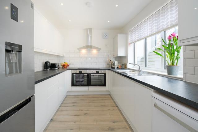 Kitchen with Fridge and Ovens .jpeg