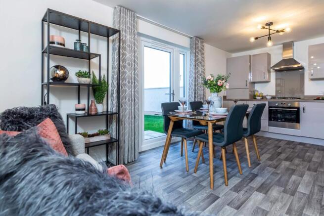 Kitchen/dining room with family area leading to the back garden of the 3 bed home, The Craigend
