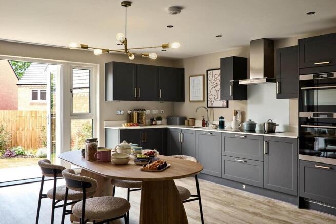 An open plan kitchen and dining area, with double doors to the garden is perfect for al fresco dini