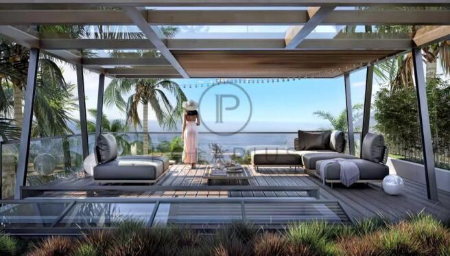 A woman in a hat stands on a modern patio overlook