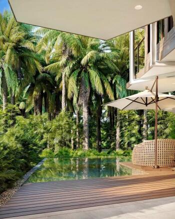 A modern patio with a wooden deck overlooks a tran