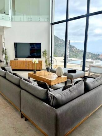 A modern living room with a large gray sectional s