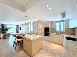 Modern open-plan kitchen and living area with ligh