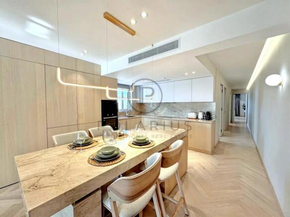 Modern kitchen with light wood finishes, featuring