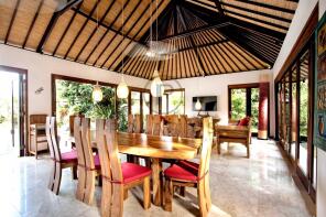 A spacious, open-plan dining and living area featu
