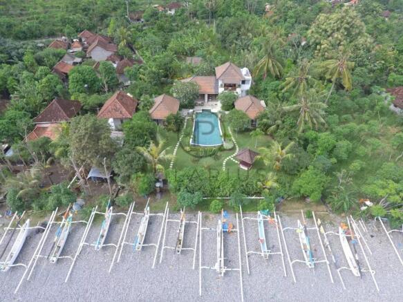 Aerial view of a lush, green resort with multiple 