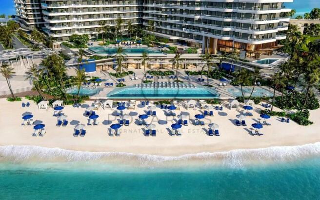 A luxurious beachfront resort with pools, palm tre