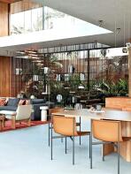 A modern, open-plan living space features a dining