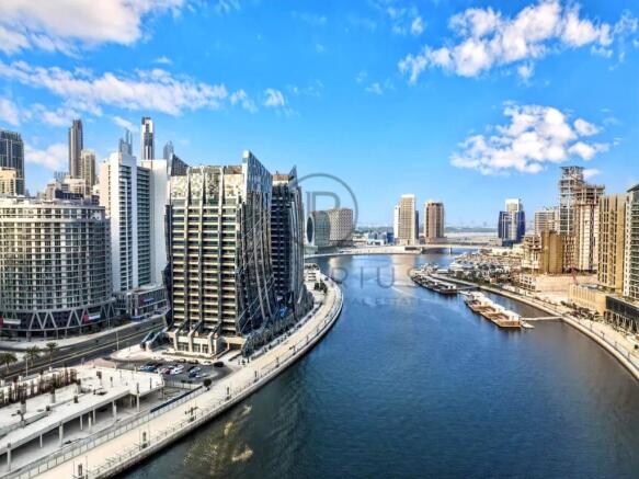 A modern cityscape with tall, sleek buildings lini