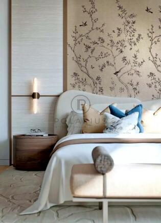 A stylish bedroom with a large bed, decorative pil