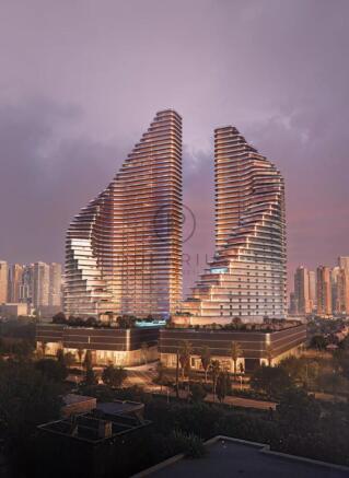 Two modern, curved skyscrapers with unique, tiered