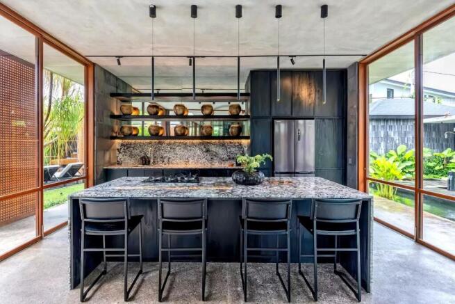 Modern kitchen with an island, sleek black cabinet
