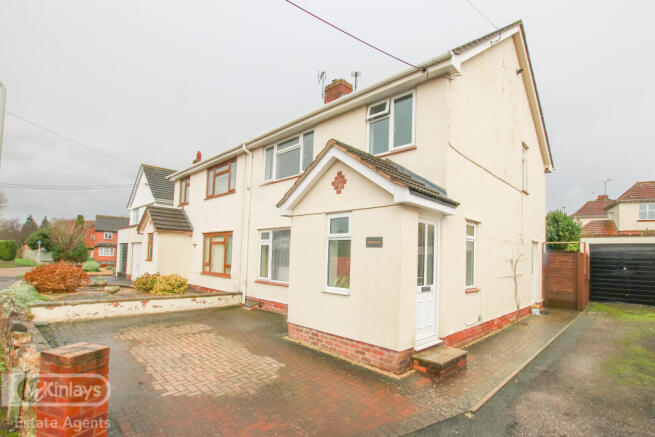 Three bedroom home with garage and parking in She
