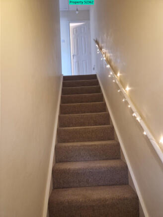 Stairs up from hall at front door