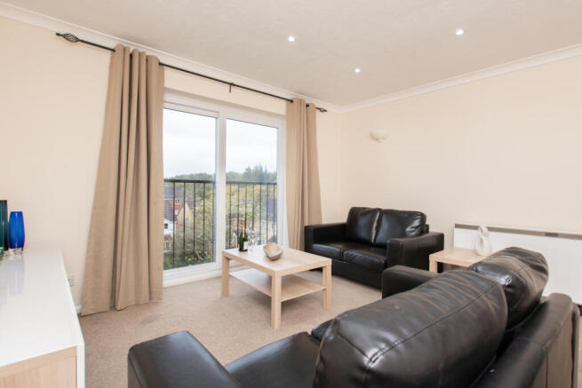 A top floor apartment with views across Worth for