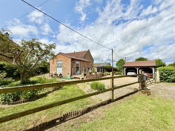 rear aspect and driveway