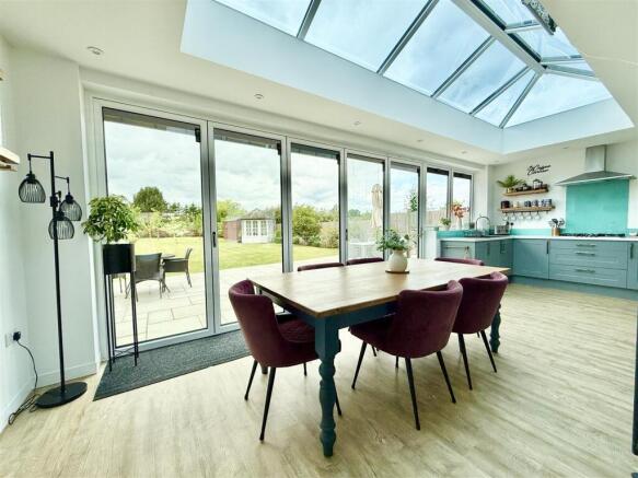 kitchen day rom with bi fold doors to patio