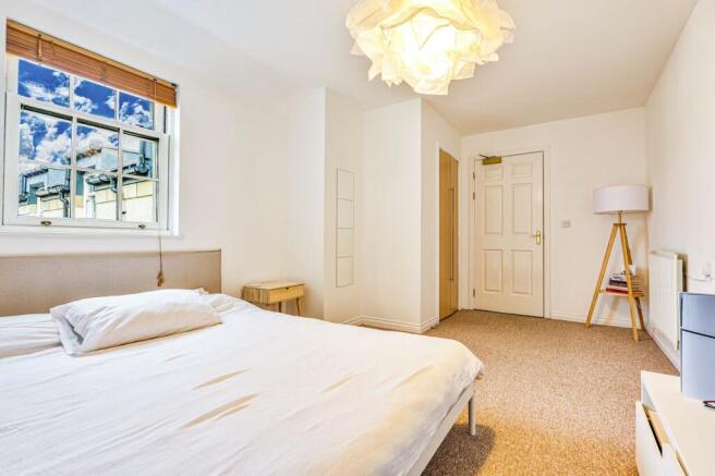 Big primary bedroom with  deep built-in wardrobe