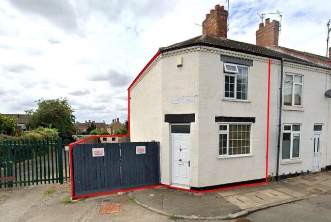 Front with gated access to DRIVEWAY & extended rea