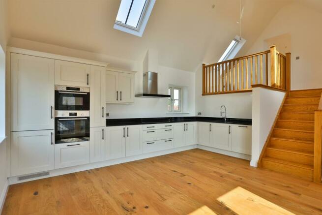 Kitchen/Dinning Room Leading To Living Space