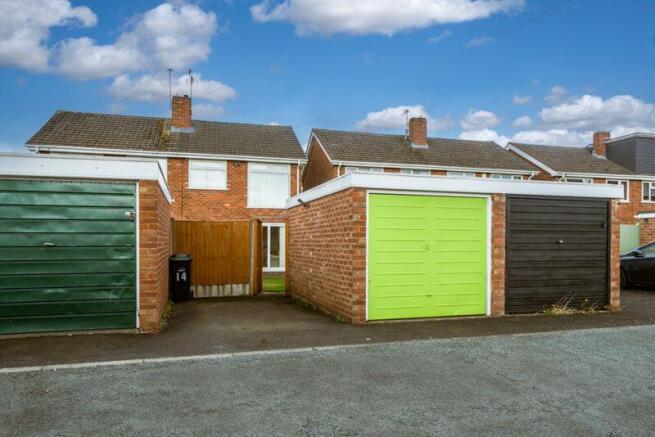 REAR GARAGE & PARKING SPACE
