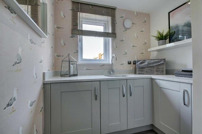 The utility room offers extra storage space